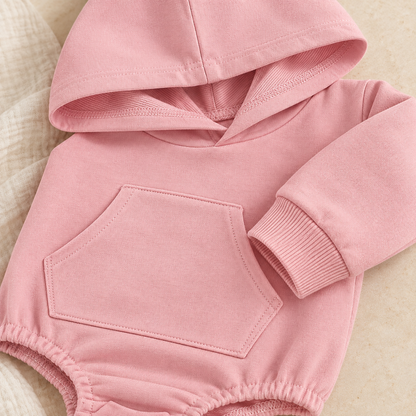 Close-up of the blush pink Hiccups Hoodie showing the soft fabric, ribbed cuff and kangaroo pocket.
